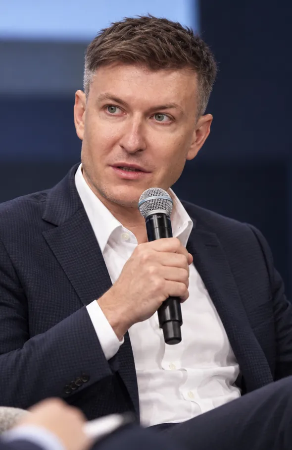 Vertical portrait of Ilia Nikolaevich Zavialov seated at a professional event